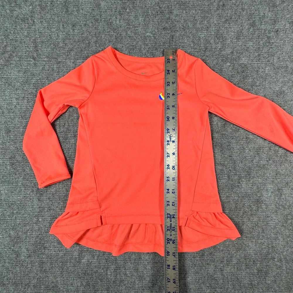 Nike Kids Dri-FIT Long Sleeve Peplum Ruffle Top Coral Pink Iridescent Swoosh